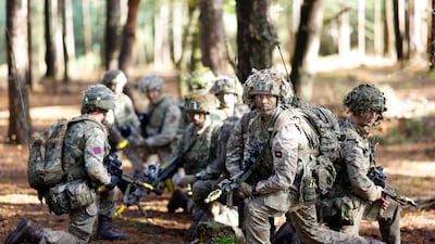 Soldiers of 1st Battalion London Guards take part in a training exercise on Hankley Common, Farnham, southern England. Getty Images