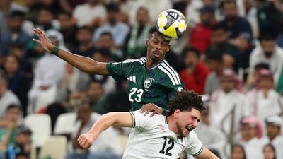 Saudi Arabia's Mohamed Kanno vies for the ball with Palestine's Khalid El Haija during their Fifa Arab Cup quarter-final at the Lusail Stadium in Qatar. Reuters