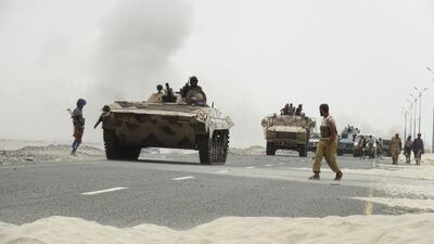 Southern Resistance fighters gather on a road leading to Yemen's Houthi-held southern province of Abyan on Saturday. Three soldiers from the UAE have been killed while taking part in a Saudi-led military campaign against Yemen's dominant Houthi group. Reuters