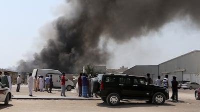SHARJAH , UNITED ARAB EMIRATES - JUNE 26 : Major fire broke out in the warehouse area in Sharjah Industrial area close to the National Paints in Sharjah. ( Pawan Singh / The National ) For News. Story by Nawal Al Ramahi