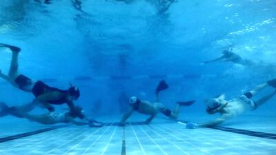 Players have to hold their breath for 10 to 30 seconds at a time and be sure not to come up for air too early – or too late. They do that through a snorkel and wear fins on their feet to propel them through the water.