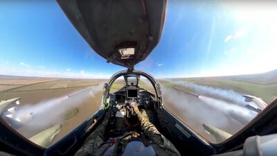 An image taken from video and released by the Russian defence ministry press service on October 10 shows a Russian Su-25 jet firing rockets on a mission at an undisclosed location in Ukraine. AP