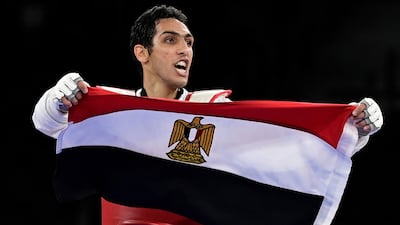Egypt's Seif Eissa celebrates after winning a bronze medal in taekwondo at the Makuhari Messe Hall in Tokyo.