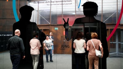 Visitors to an exhibition about demografic change called 'Ey Alter' by carmaker Mercedes Benz in Berlin, Germany, can choose between the "young" or "old" door to enter. Axel Schmidt / Reuters