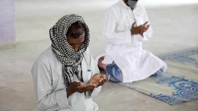 Muslims sit apart as they perform Eid Al Fitr prayers at home during lockdown, to combat coronavirus pandemic, in Kolkata, India. EPA