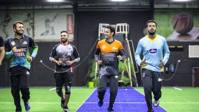 Saqib Nazir, captain, left to right, Naeemuddin Aslam, Sameer Nayak and Isuru Rumesh take part in a training session with the UAE national indoor cricket team. Christopher Pike / The National