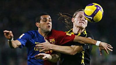 Barcelona's Daniel Alves, left, proved ineffective against Getafe.