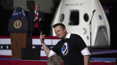 President Donald Trump acknowledges SpaceX founder Elon Musk, right, after the successful launch of the SpaceX Falcon 9 rocket with the manned Crew Dragon spacecraft at the Kennedy Space Centre in Cape Canaveral, Florida. AFP