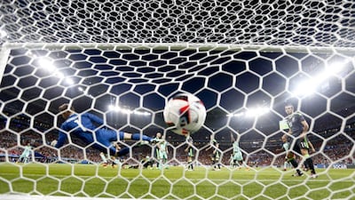 Portugal’s Cristiano Ronaldo scores past Wales goalkeeper Wayne Hennessey during the Euro 2016 semi-final match between Portugal and Wales, at the Grand Stade in Decines-Charpieu, near Lyon, France, Wednesday, July 6, 2016. Frank Augstein / AP Photo