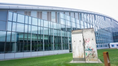 Part of the fallen Berlin Wall adorns the grounds outside the new Nato headquarters in Brussels. Jack Moore for The National