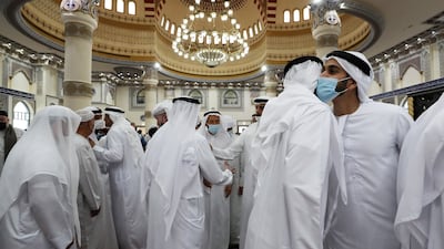 People greeting each other’s after the morning Eid al-Fitr prayers at the Al Farooq Omar Bin Al Khattab Mosque in Dubai. Pawan Singh / The National