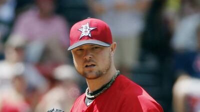 Jon Lester will be trading Boston's red for the green-and-gold of the Oakland Athletics. Michael Dwyer / AP Photo