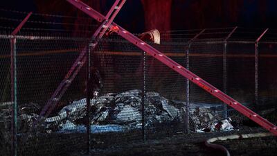The wreckage of the plane that crashed and caught fire at Dillingham Airfield on Hawaii's Oahu island. Honolulu Star-Advertiser via AP)
