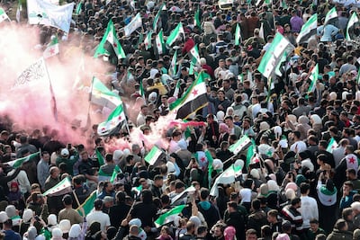 Residents of Hama in Syria gather to mark the first anniversary of the fall of the Assad regime. Reuters