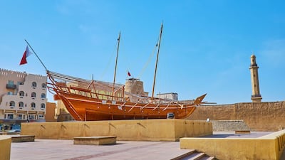 The area in front of the historic Al Fahidi Fort in Dubai is decorated with an installation of a traditional dhow. Alamy