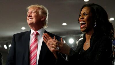 Republican presidential nominee Donald Trump and Omarosa Manigault (R) attend a church service, in Detroit, Michigan, U.S. Reuters