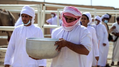 The milk is brought to the judges' tent.