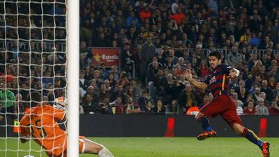 Barcelona’s Luis Suarez scores the fifth goal for the club in their 5-2 La Liga win over Rayo Vallecano on Saturday night. Albert Gea / Reuters
