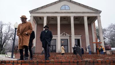 Mourners outside the church where the funeral service for Mr Nichols was held. AP