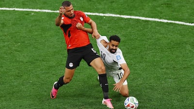New Zealand's Sarpreet Singh in action with Egypt's Ramy Rabia. Reuters