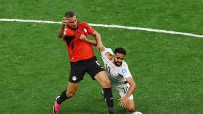 New Zealand's Sarpreet Singh in action with Egypt's Ramy Rabia. Reuters