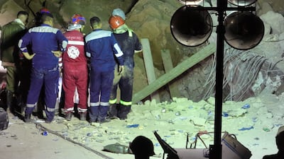 Teams worked through the night and were able to provide food and water to people trapped underneath the shrine. AFP