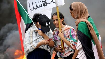 Sudanese women gather during a demonstration to commemorate the first anniversary of a deadly crackdown carried out by security forces on protesters during a sit-in outside the army headquarters, in Khartoum, Sudan. AP Photo