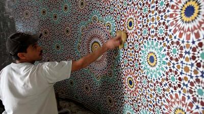 Qasim Thaesh, a craftsman that has been flown in from Morocco, works on the mosaic in the Mehrab area at the under construction Al Farooq mosque in Al Safa area in Dubai.