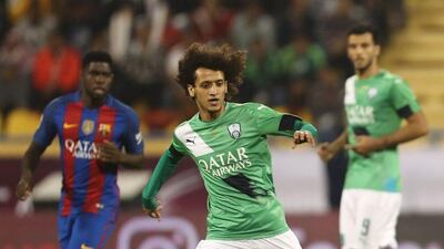 Omar Abdulrahman, turning out for Al Ahli, in action against Barcelona. Karim Jaafar / AFP