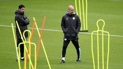 Manchester City manager Pep Guardiola, right with his assistant manager Mikel Arteta. Reuters