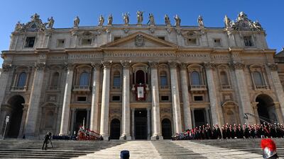 Swiss guards stand guard before the Pope's blessing. AFP