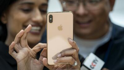 An attendee demonstrates the Apple Inc. iPhone XS Max. David Paul Morris / Bloomberg