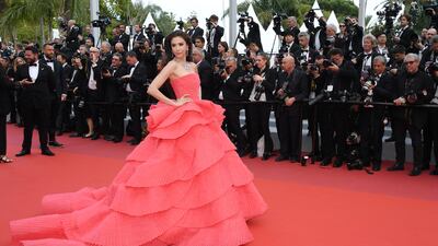 Jensen's coral tulle layered gown was specially made for her by Cinco. Getty Images