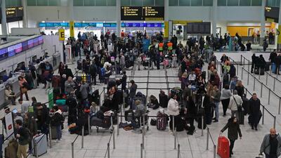 Passengers wait around in the terminal building at Gatwick Airport after drones flying illegally over the airfield forced the closure of the airport. Reuters