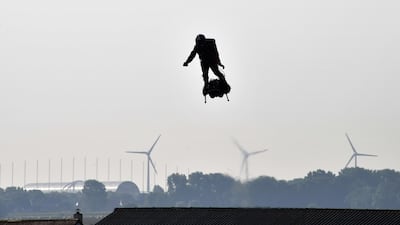 Franky Zapata stands on his jet-powered "flyboard" as he takes off from Sangatte, northern France. AFP