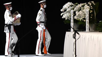 Members of an honour guard carry Abe's ashes during his funeral. Abe was delivering a speech near a train station in the western city of Nara when he was shot dead by an assailant on July 8. It was the first assassination of a sitting or former Japanese prime minister since the 1930s. AP