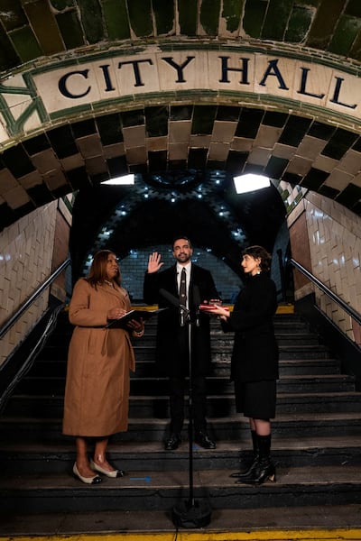 Zohran Mamdani being sworn in as mayor of New York City, flanked by his wife Rama Duwaji and New York Attorney General Letitia James, at Old City Hall Station, New York. Reuters