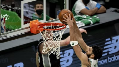 Jayson Tatum of the Boston Celtics dunks the ball against the San Antonio Spurs. AFP