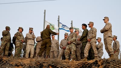 Members of the US Marines, the first armoured division of the US Army and the German armed forces on the hilltop in Sderot