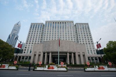 The Chinese national flag at half-mast at the People's Square to mourn victims of COVID-19 on April 04 in Shanghai, China. Yifan Ding / Getty