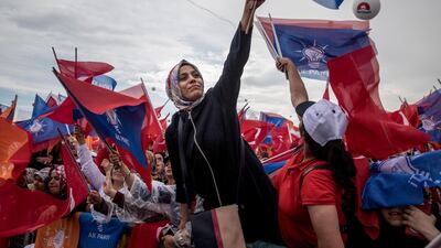 Supporters cheer and salute as they listen to Turkey's President Recep Tayyip Erdogan speak during an AKP election rally on June 17, 2018 in Istanbul, Turkey. Chris McGrath / Getty