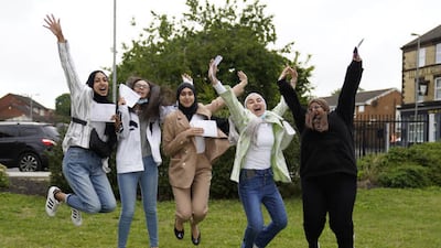 Pupils at Archbishop Blanch School in Liverpool celebrate as they receive their A-level results.