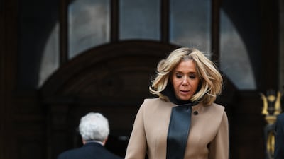 Brigitte, wearing a camel Louis Vuitton coat with black leather detail, at the Palais Garnier opera house in Paris on March 25, 2019. AFP