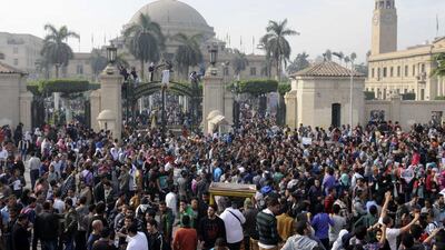 Student protesters and supporters of ousted Islamic President Mohammed Morsi gather outside the main gate of Cairo University on December 1. Mohammed Asad / AP