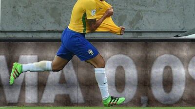 Brazil’s Renato Augusto celebrates after scoring against Uruguay during their Russia 2018 FIFA World Cup South American Qualifiers’ football match, in Recife, northeastern Brazil, on March 25, 2016. AFP PHOTO / VANDERLEI ALMEIDA