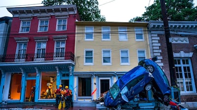 Rescue personnel examine damage on Main Street after a flash flood rushed through the historic town of Ellicott City, Maryland, USA, 27 May 2018. The National Weather Service stated as much as 9.5 inches of rain fell in the area. Jim Lo Scalzo / EPA