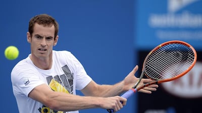 Andy Murray returns the ball during practice on Sunday at the Australian Open in Melbourne. The Scot wants to build on his memorable Wimbledon title from last year. Franck Robichon / EPA