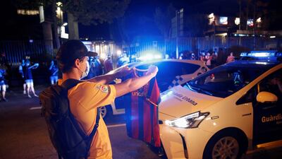 Dozens of FC Barcelona fans gather outside Camp Nou Stadium. EPA