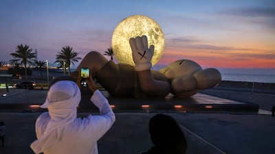 Holiday at Souq Al Mina by US artist Kaws, part of the Manar Abu Dhabi public light art exhibition. Victor Besa / The National
