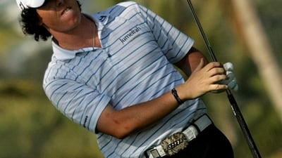 Ireland's Rory McIlroy eyes the ball after playing a shot on the 13th hole during the third day of the Dubai Desert Classic golf tournament in the Gulf emirate on January 31, 2009. AFP PHOTO/MARWAN NAAMANI *** Local Caption *** 212460-01-08.jpg